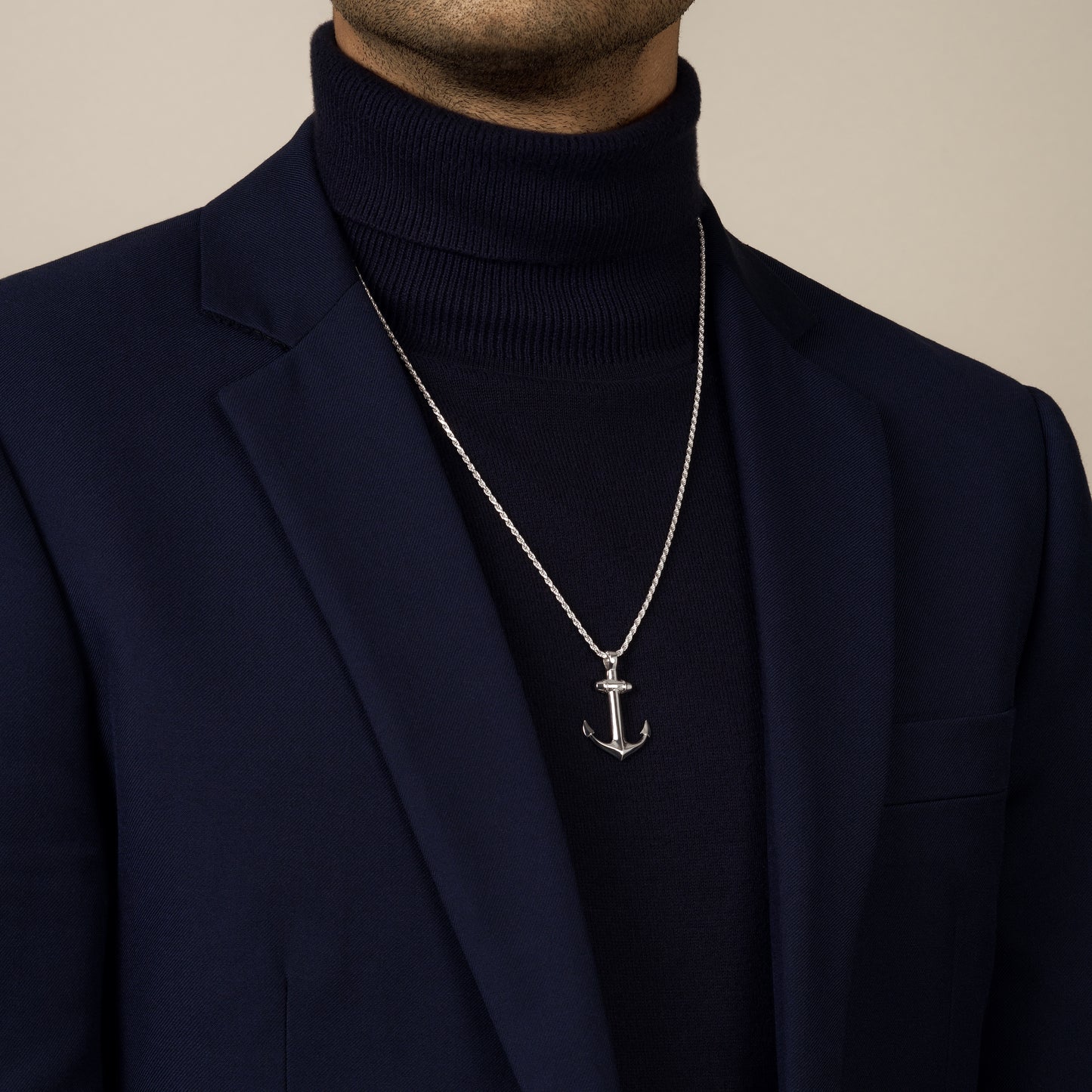 model wearing anchor amulet pendant with a 1.8mm diamond cut rope chain in sterling silver