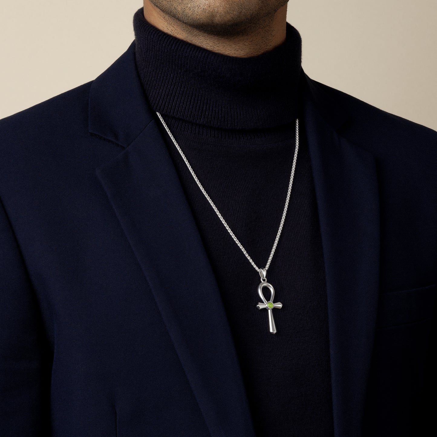model wearing a ancient egyptian ankh with peridot gemstone amulet pendant with 1.9mm spiga wheat chain in sterling silver