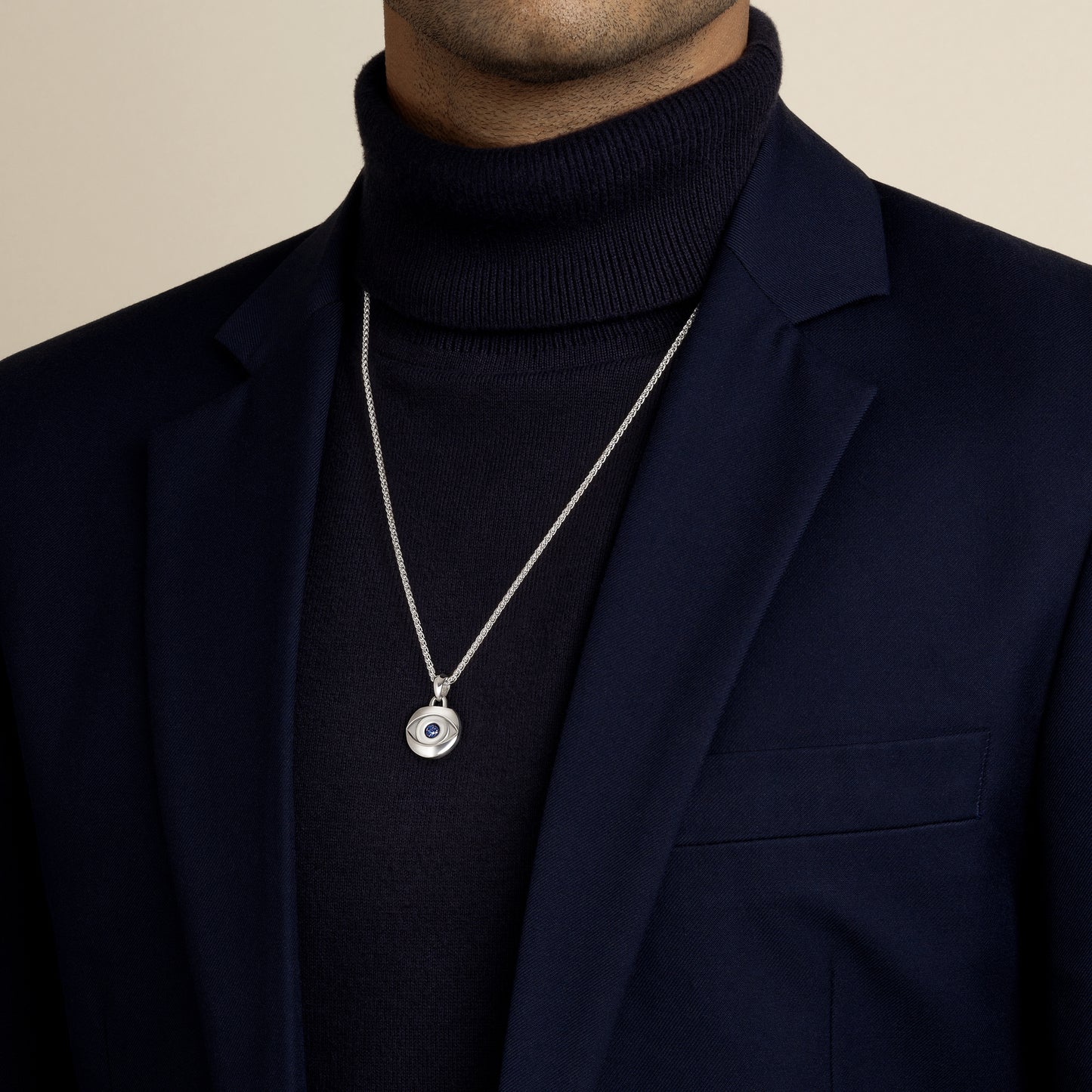 model wearing a ancient egyptian evil eye with lapis lazuli gemstone amulet pendant with 1.9mm spiga wheat chain in sterling silver