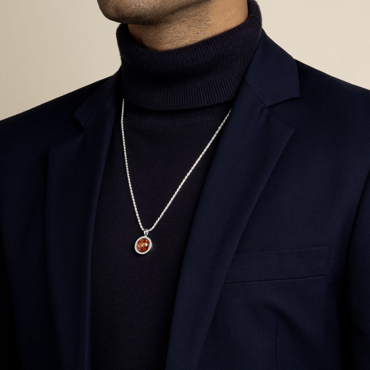 model wearing amber amulet pendant with 1.8mm diamond cut rope chain in sterling silver