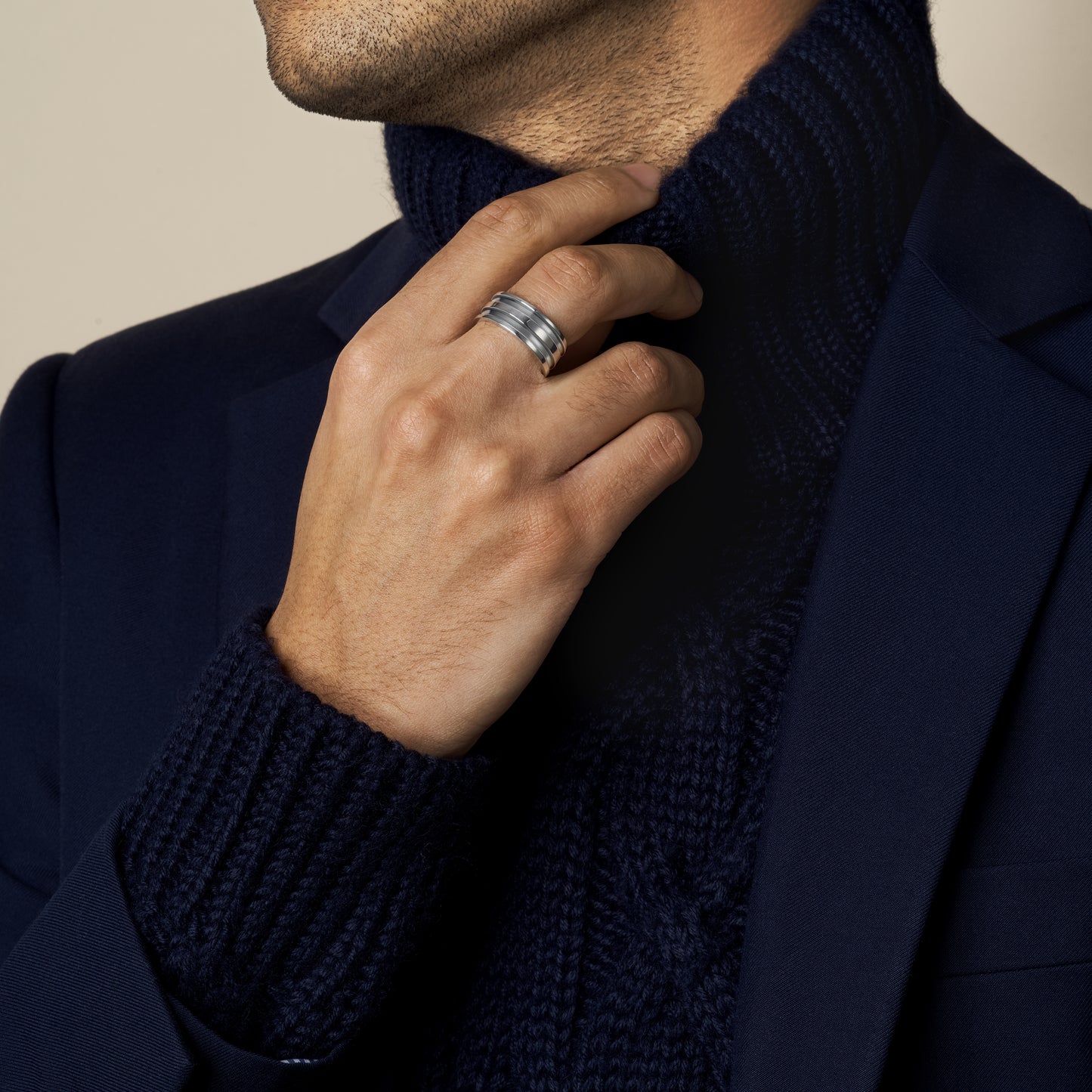 model wearing grooved band ring in sterling silver