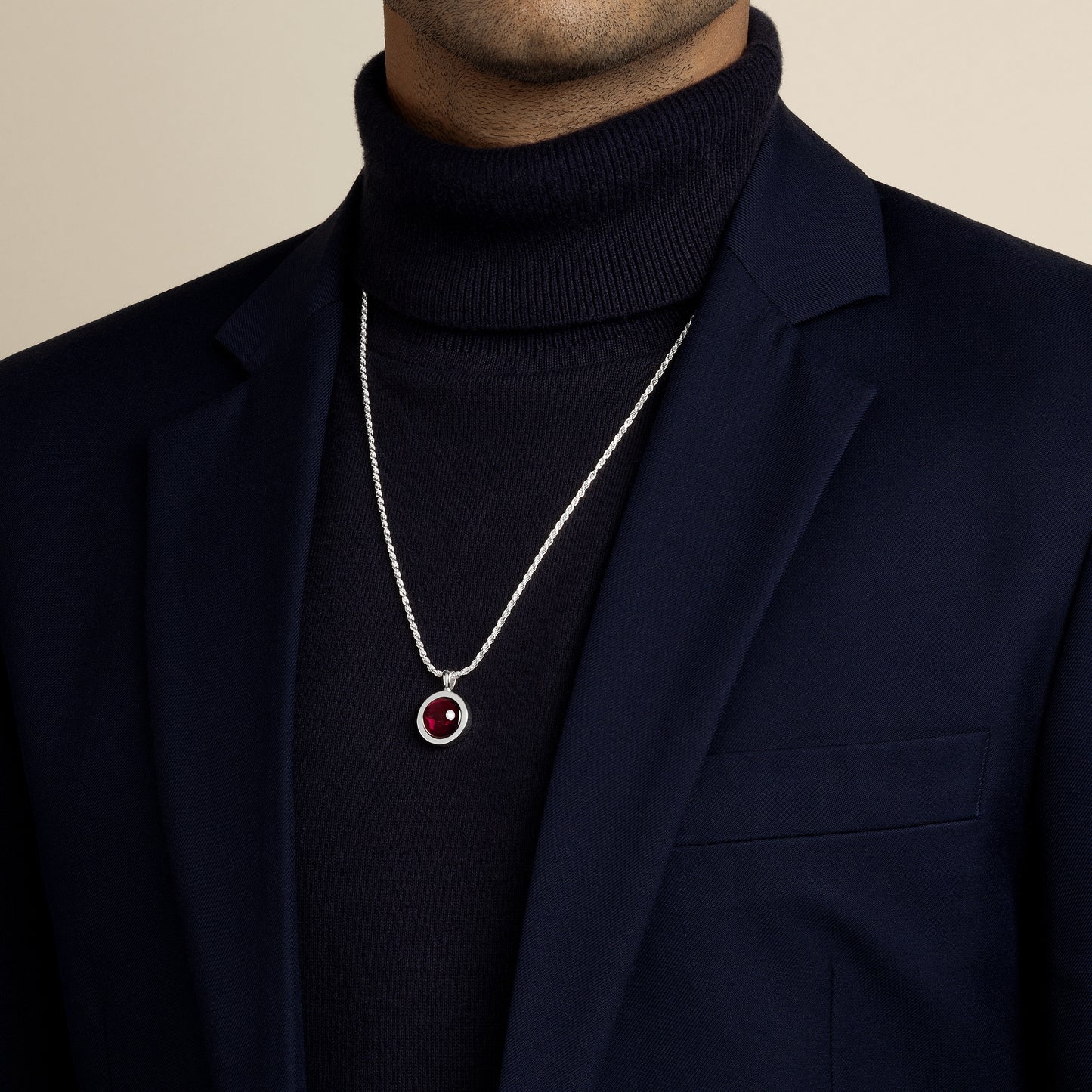 model wearing indian garnet amulet pendant with 1.8mm diamond cut rope chain in sterling silver
