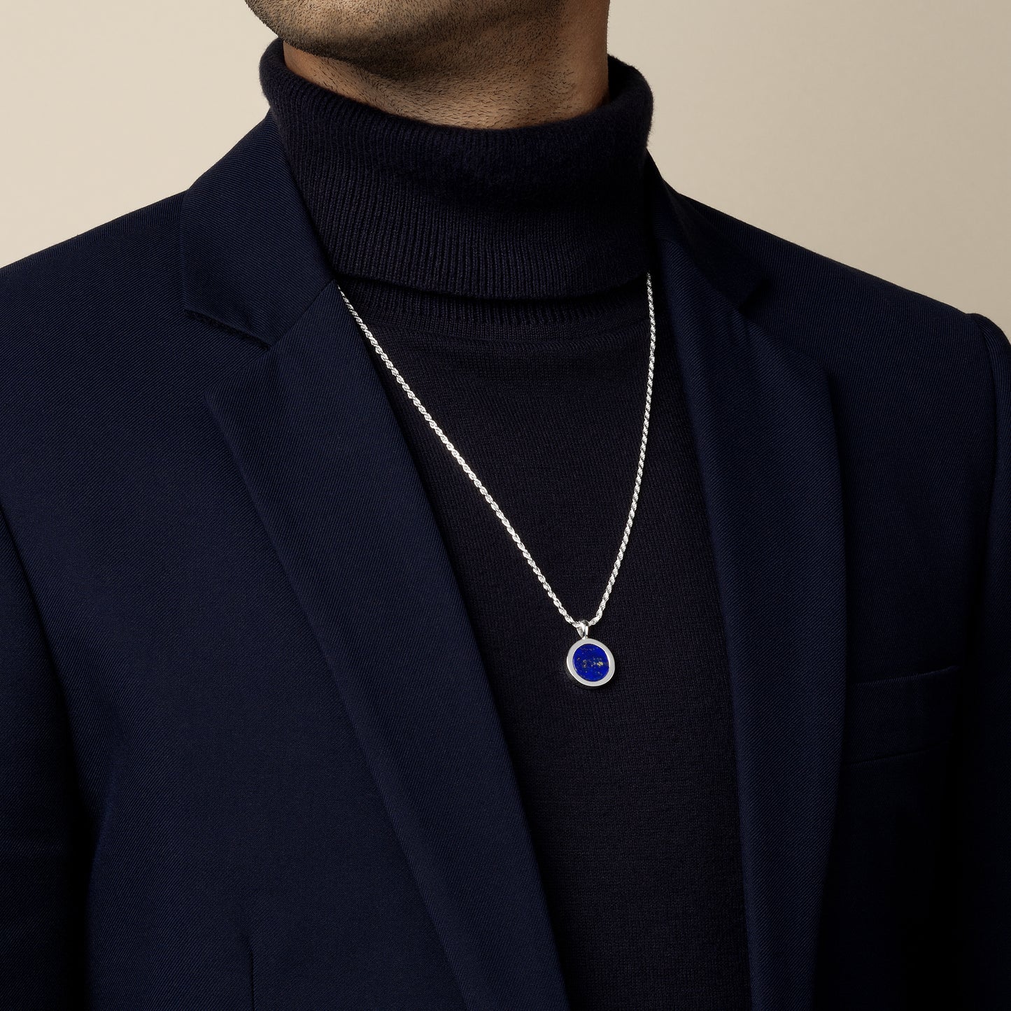 model wearing lapis lazuli amulet pendant with 1.8mm diamond cut rope chain in sterling silver
