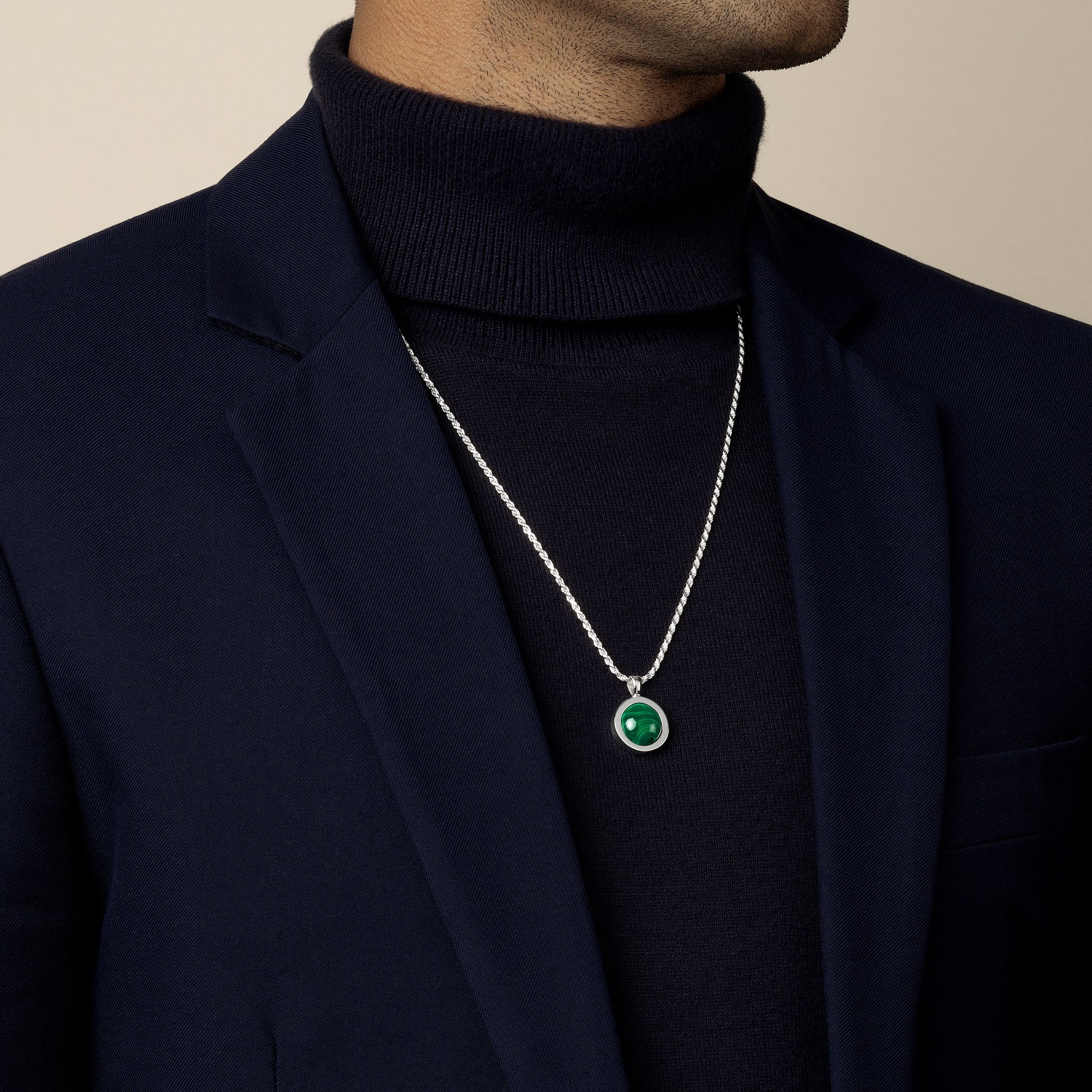 model wearing malachite amulet pendant with 1.8mm diamond cut rope chain in sterling silver